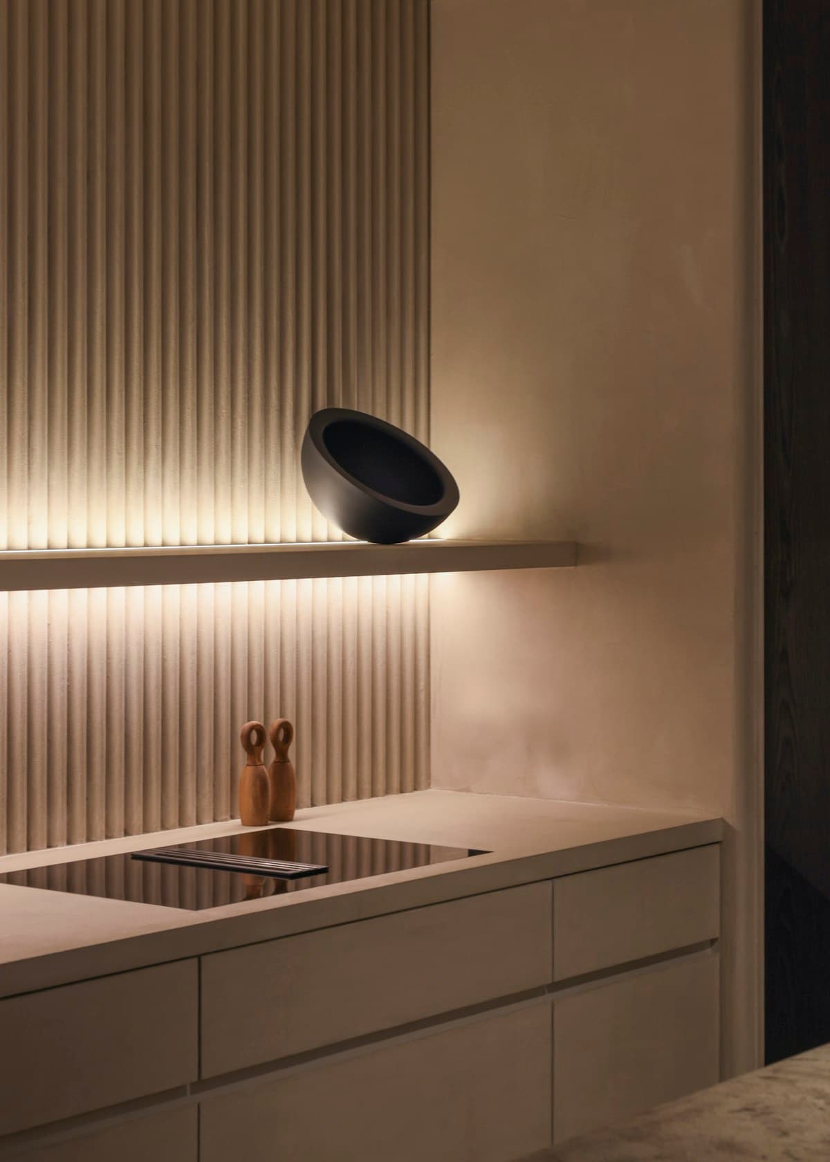 Modular kitchen with handleless cabinetry and stone worktop